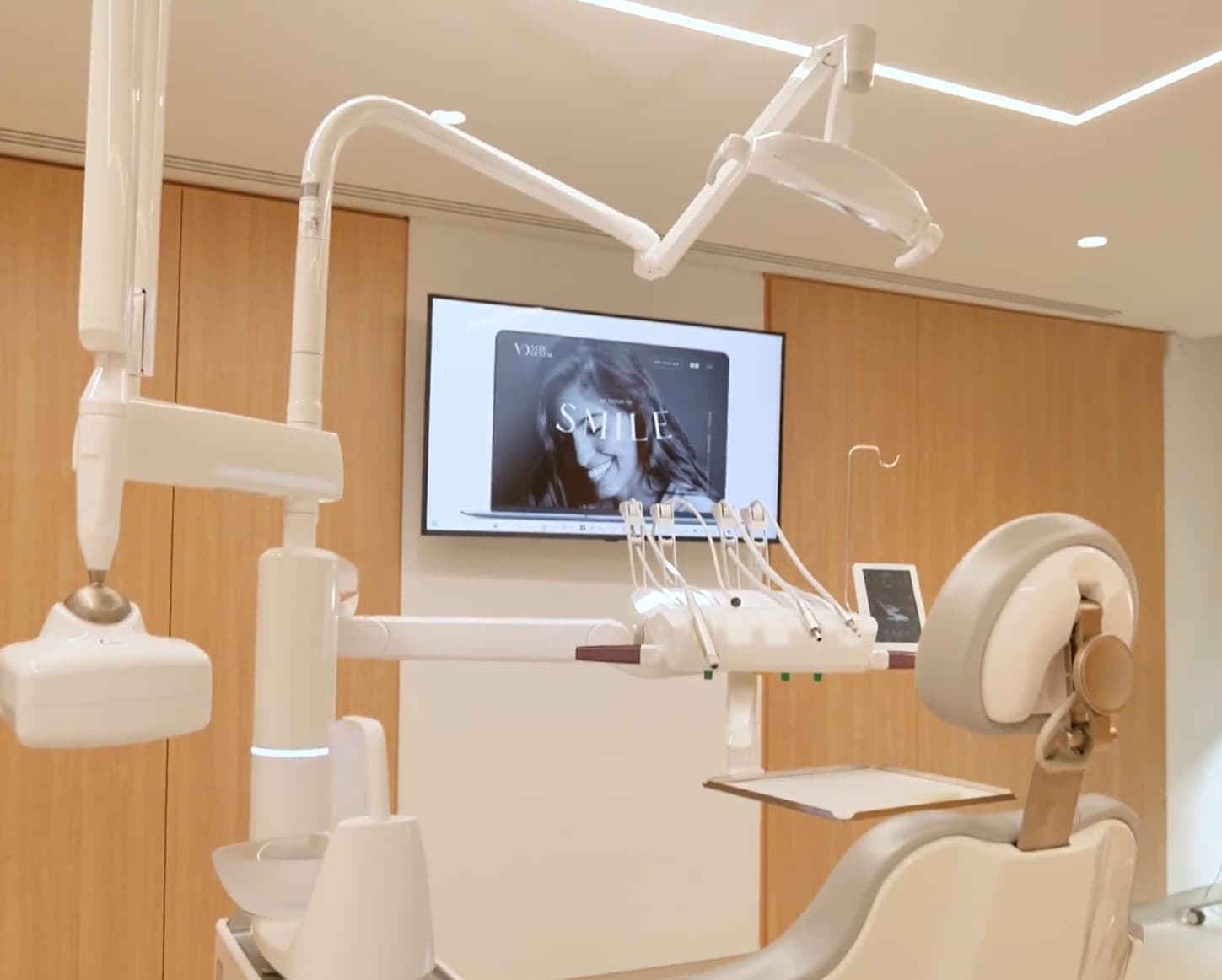 Treatment room with ceiling TV at Vere Dental